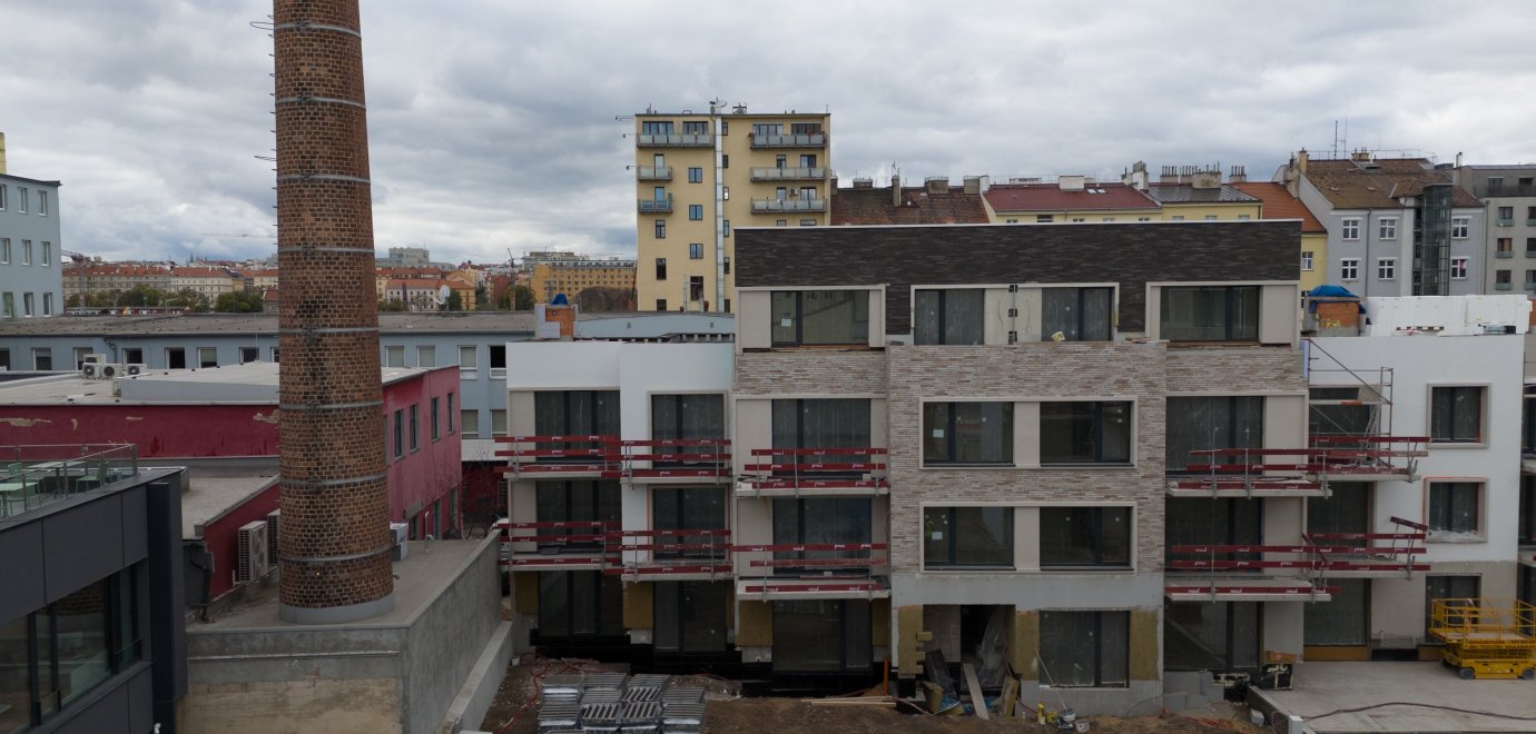 We completed plastering in 95 % of the apartments and poured floors in 50 % of the apartments